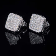 Angled view of square moissanite stud earrings showing depth and screw-back posts, iced-out white gold
