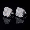 Angled view of square moissanite stud earrings showing depth and screw-back posts, iced-out white gold