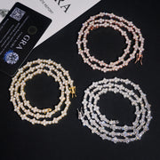 Rose, yellow and white 10K gold moissanite tennis chains coiled beside a GRA report card – CustomHipHop