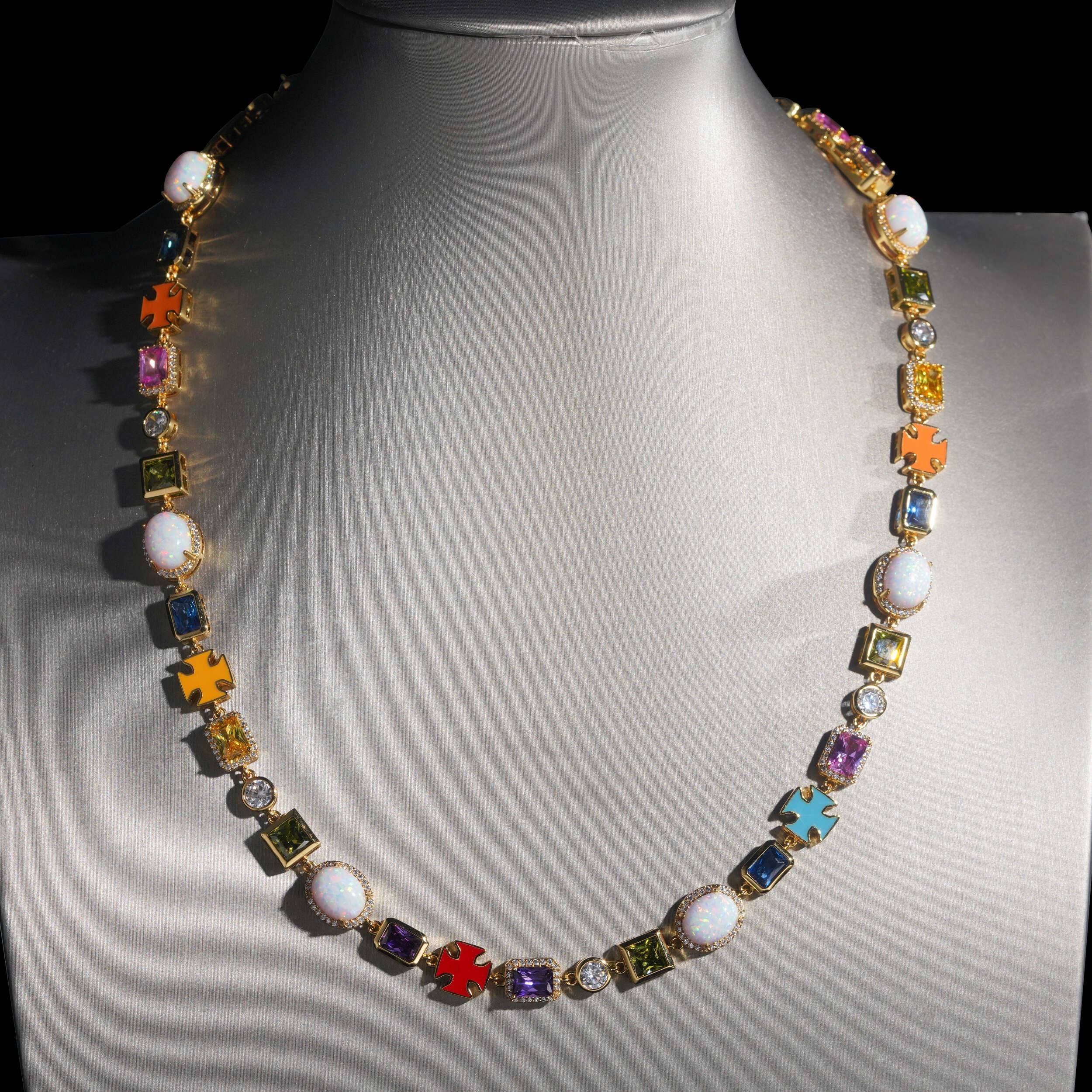 Colorful Hip Hop Jewelry necklace with gold, gems, and pearls on a mannequin bust