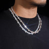 Close neck shot of sparkling 5mm moissanite spike tennis chain layered in white and rose gold tones – CustomHipHop