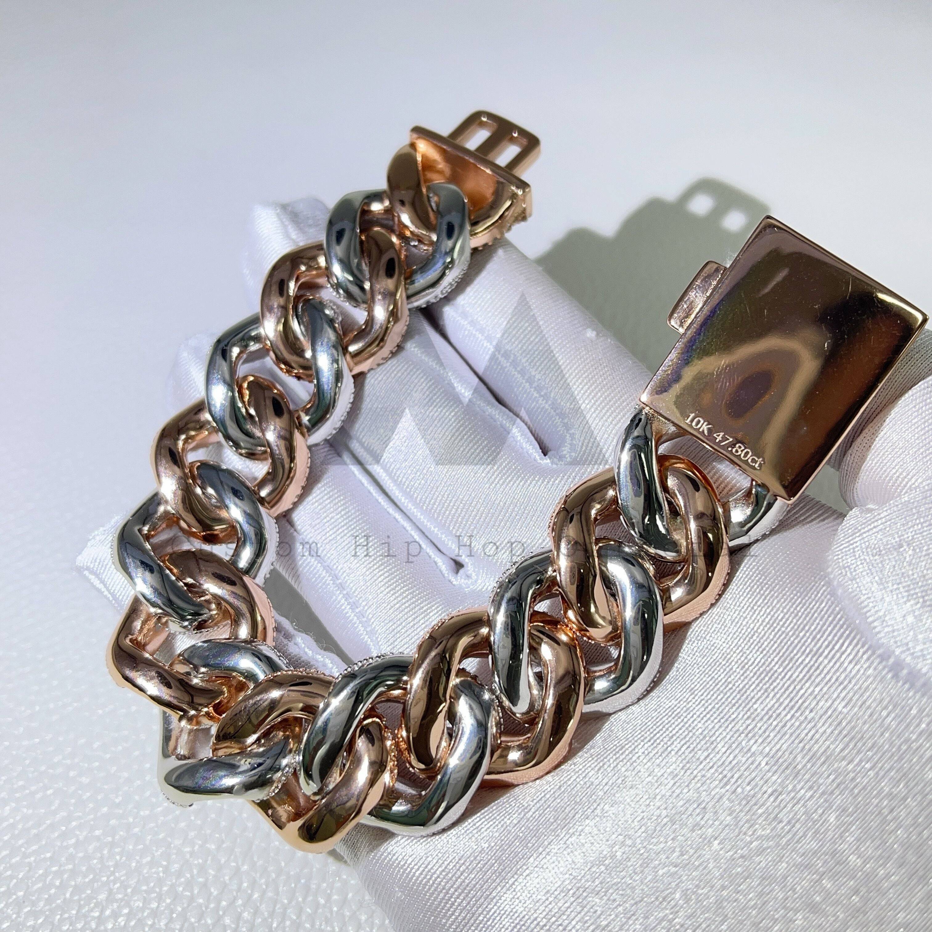 23MM Rose Gold Cuban Bracelet on white cloth, showcasing silver and rose gold links