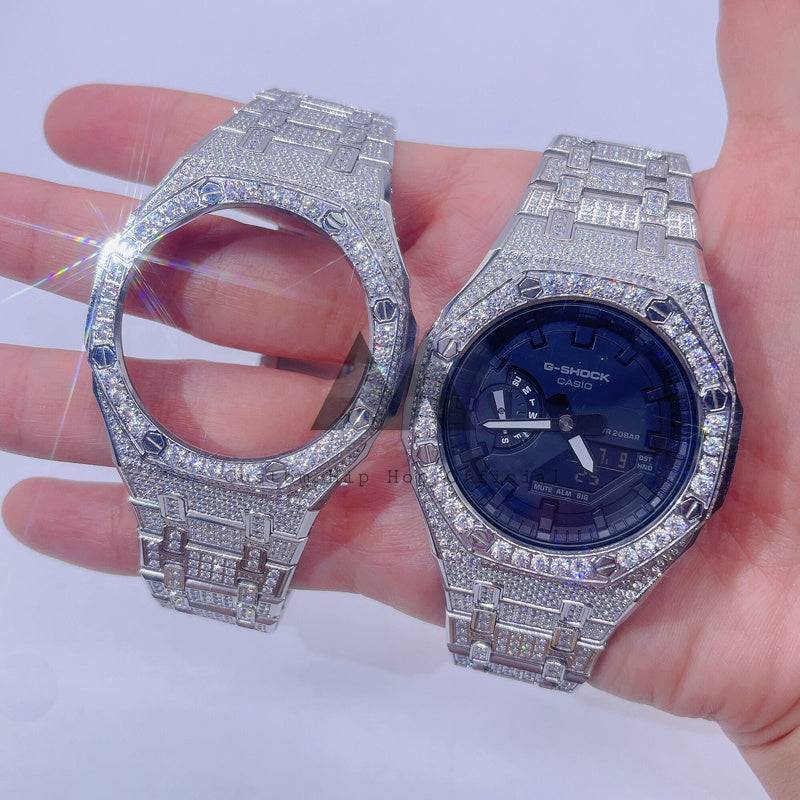 Hand holding Moissanite Watch and hip hop jewelry G-SHOCK CASIO watches.